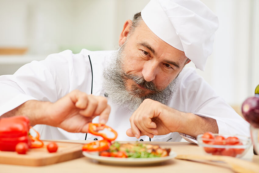 chef-plating-dish-in-restaurant-2021-09-24-04-04-22-utc